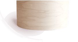 A bare maple drum shell before finishing
