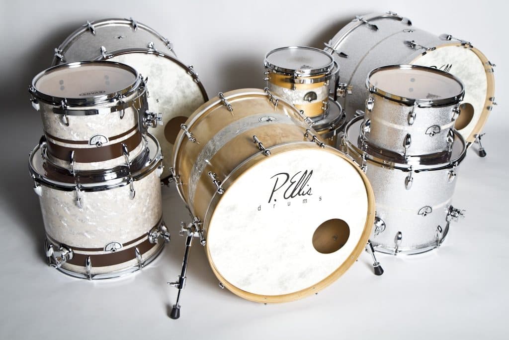 A P. Ellis custom drum kit in white pearl and natural maple finishes
